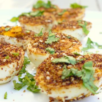 Fried boiled eggs with spices and herbs