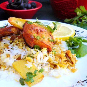Fish pieces with rice, potatoes and lemon