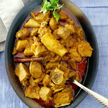 Indian goat curry in oval shaped bowl