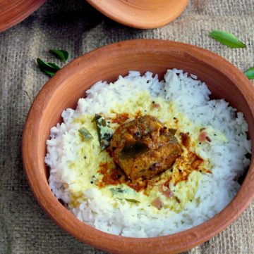 Kerala style fish curry served over rice