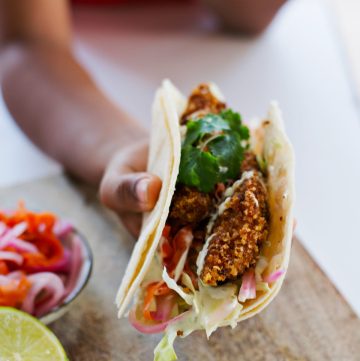 Boy holding fish tacos