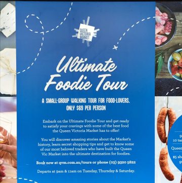Blue signboard advertising food tour