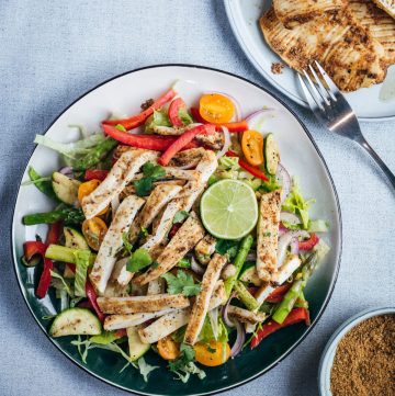 Spicy grilled calamari salad in blue plate
