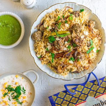 meatball pilaf with saffron in white bowl