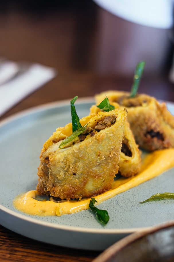 fried lamb roll served on plate